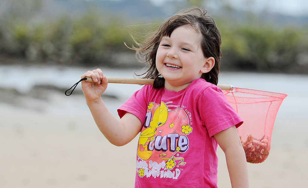 Five-year-old Emma Whitfield enjoys the simple pleasures of collecting seashells by the seashore at Pialba. Five-year-old Emma Whitfield enjoys the simple pleasures of collecting seashells by the seashore at Pialba.
